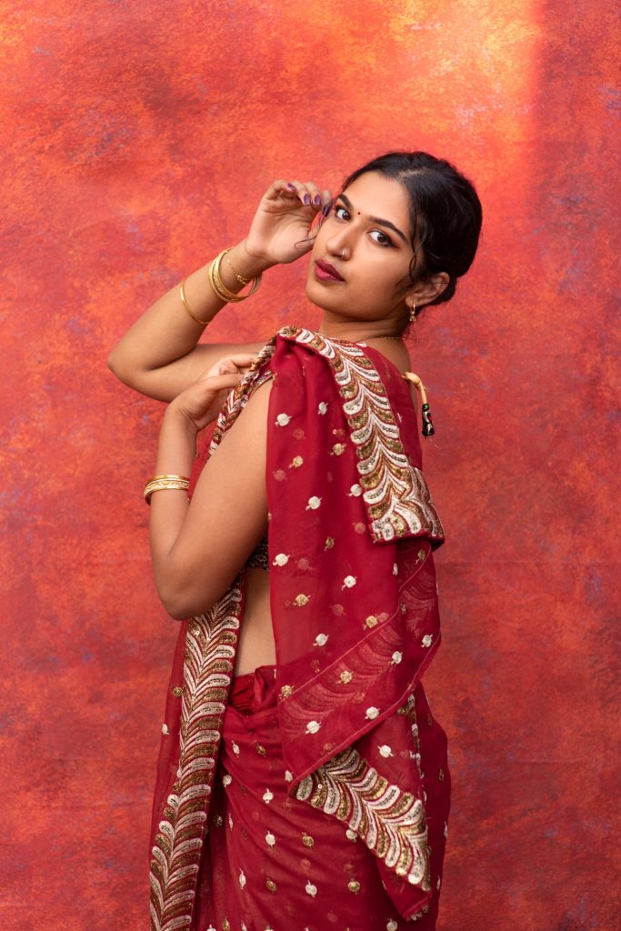 young-woman-posing-while-wearing-traditional-sari-garment (1) (1) (1)